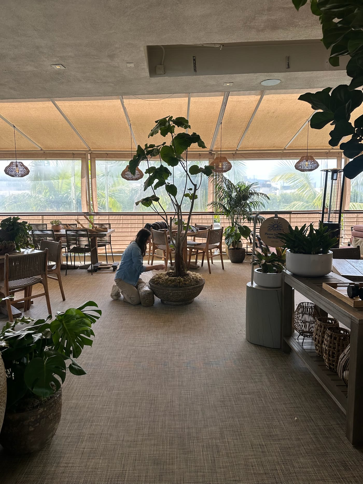 The team dressing a planter between tables